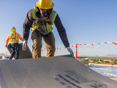 tech installing DEXcell roof cover board