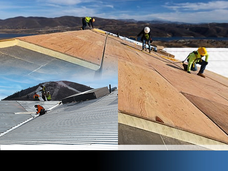 roofers working on metal roof system
